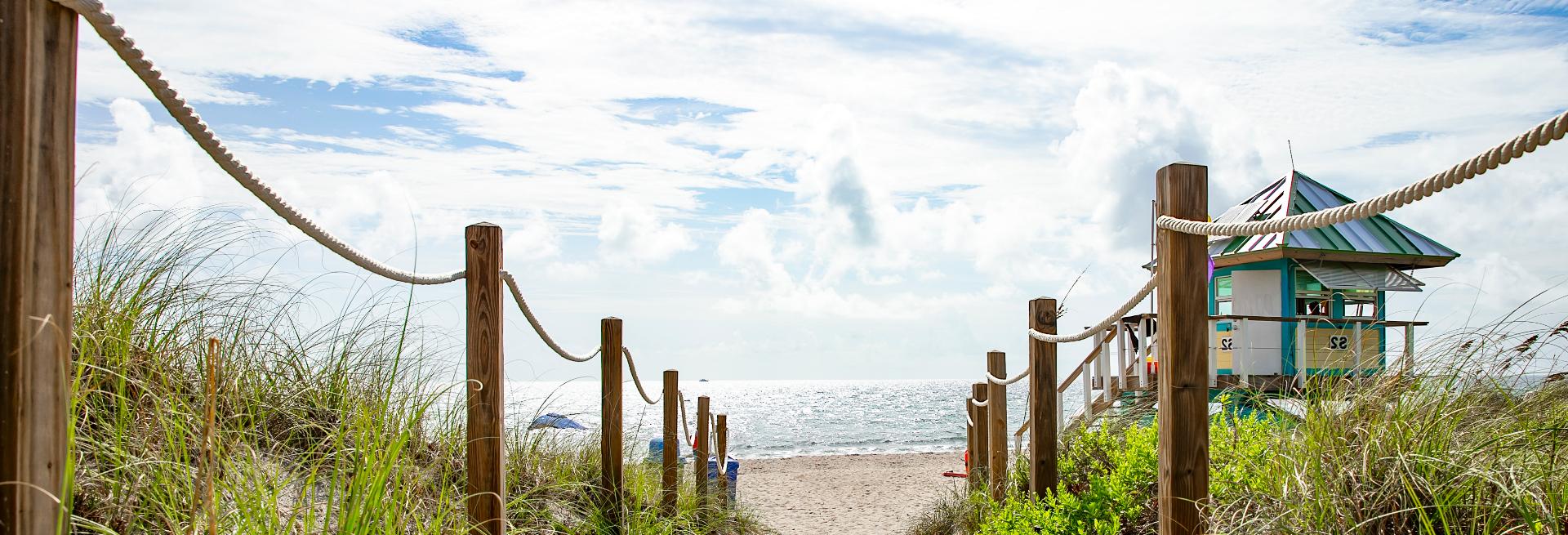 Sandy beach walkway leading to the ocean